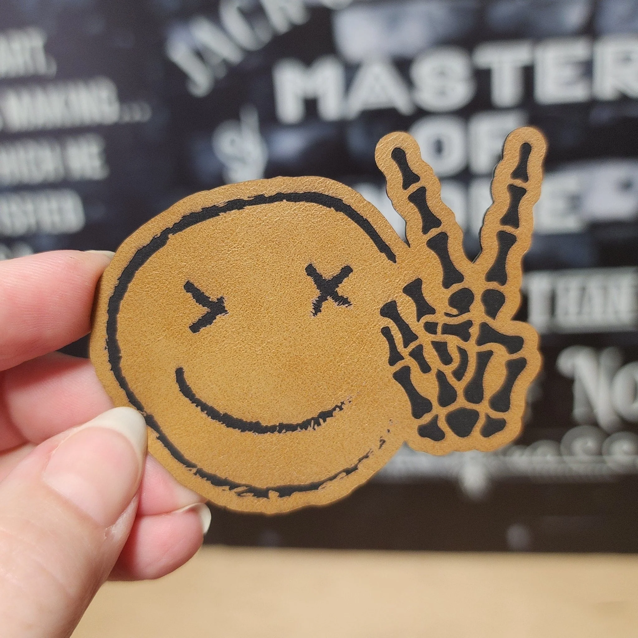 Peaceful Skull Smile (Saddle Tan) Engraved Leatherette Hat Patch - MR01