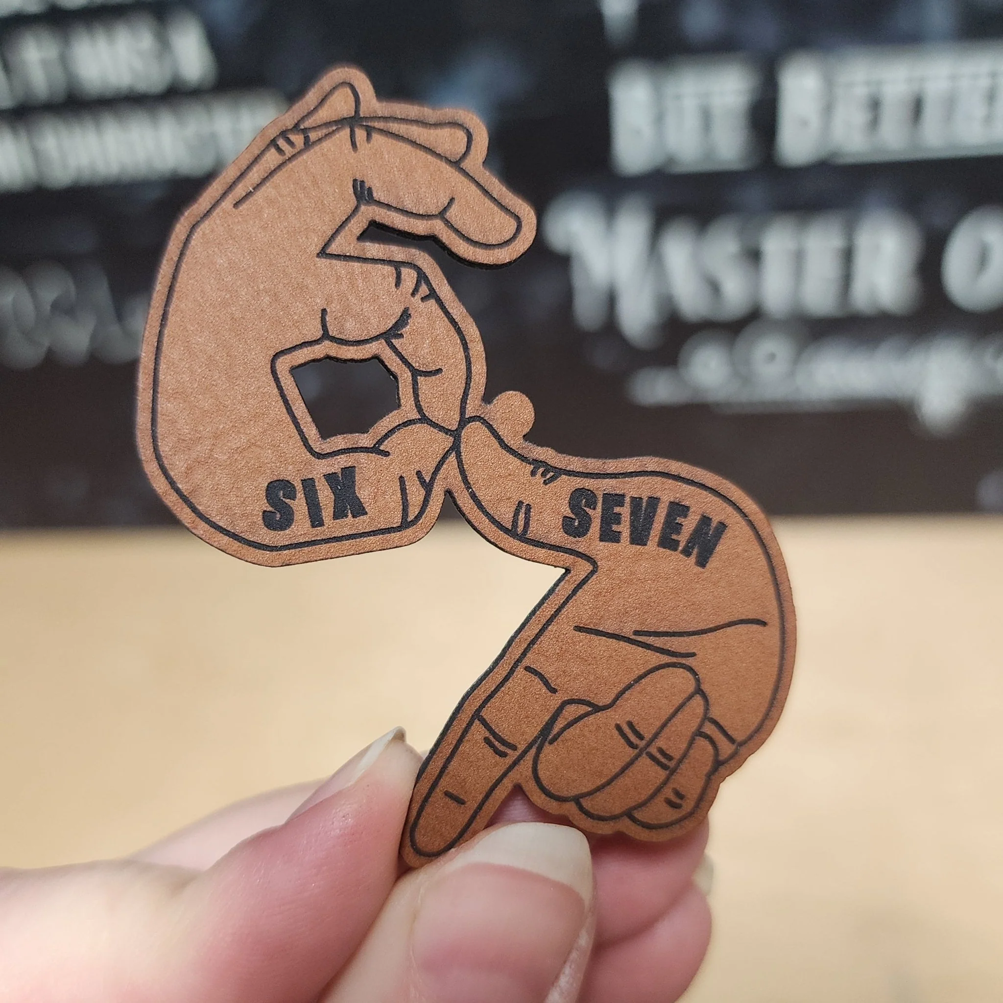 Six and Seven Hand Sign (Rawhide)  Engraved Leatherette Hat Patch - MR01